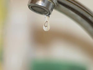 Tap with water droplet