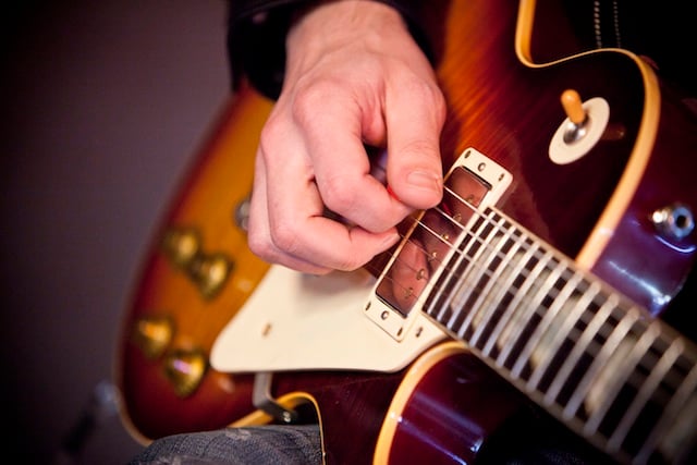 The Bonamassa pickups in action Close-up of picking hand with a Les Paul