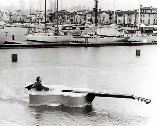 guy in a guitar boat