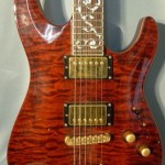 Gold hardware, large fretboard inlay, and quilted maple...shine on!