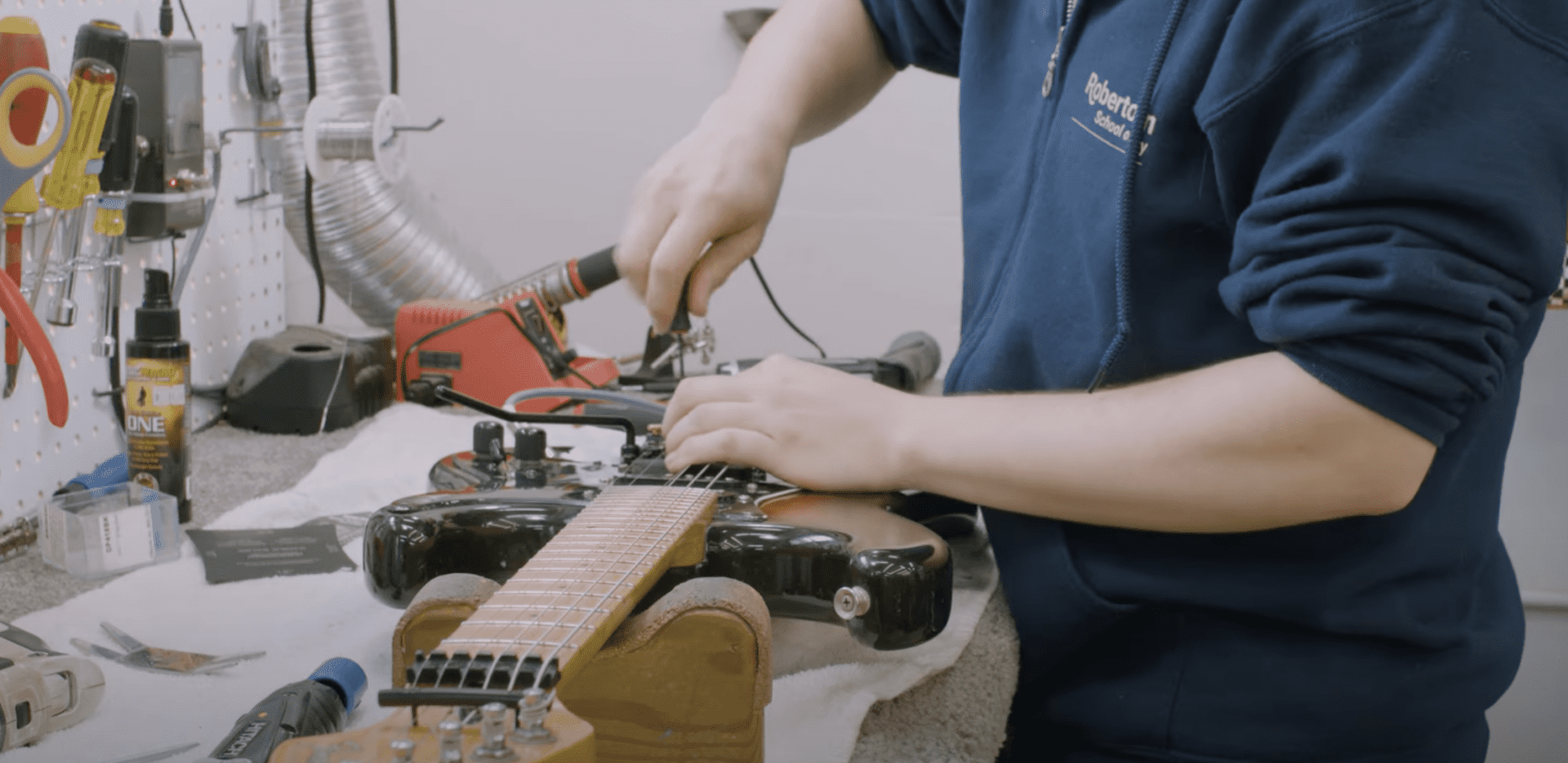 Guitar tech working on Japanese Strat