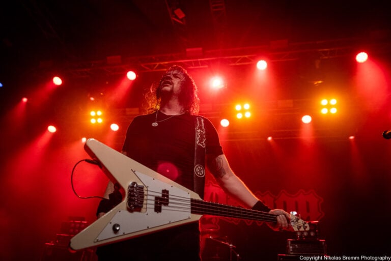 Jarvis Leatherby on stage with his Flying V Bass